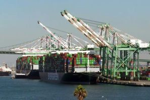 Hundreds of truck drivers wait for dozens of ships to unload their containers in California as the White House announces that it will now work 24 hours a day in an attempt clear the backlog