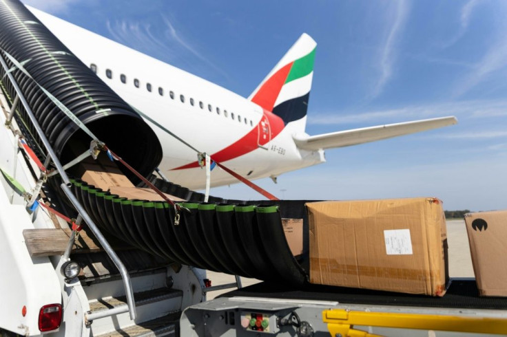 Cargo is unloaded from an international flight at Rickenbacker International Airport in Columbus, Ohio, October 11, 2021