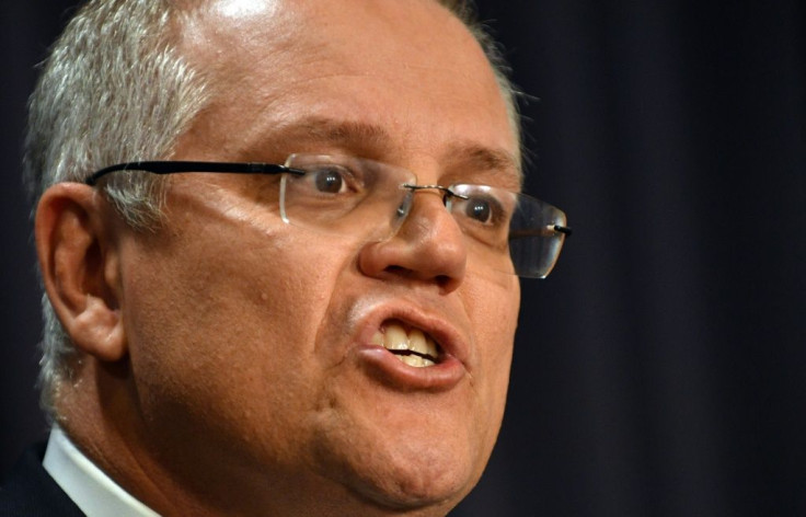 Australia's prime minister Scott Morrison has withdrawn a threat to skip a landmark climate summit in Glasgow next month