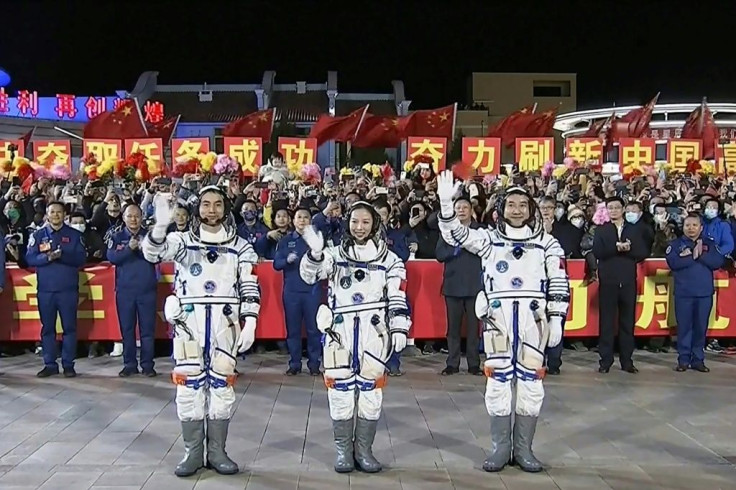 Astronauts (L-R) Ye Guangfu, Wang Yaping and Zhai Zhigang, pictured in a screen grab of footage from Chinese state broadcaster CCTV, blasted off from the Jiuquan Satellite Launch Centre in the Gobi desert, in northwest China on October 16, 2021
