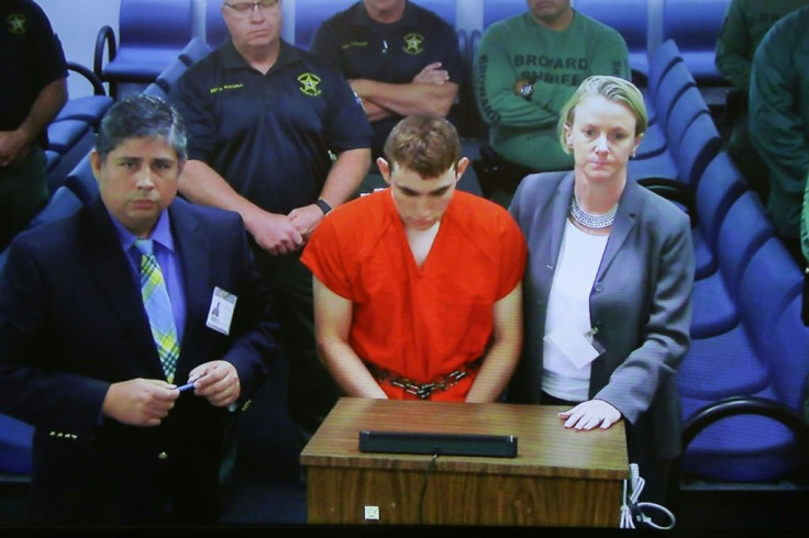 Nikolas Cruz, accused of killing 17 in the February 14, 2018 massacre at a high school in Parkland Florida, pictured in court a day after the attack