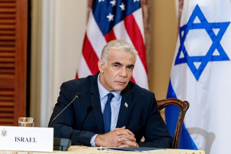 Israeli Foreign Minister Yair Lapid, speaking at a joint news conference in Washington on October 13, 2021, warned of a military response on Iran