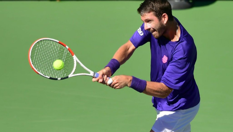 Cameron Norrie of Great Britain hits a two-handed backhand to Grigor Dimitrov of Bulgaria in their semi-final match at the Indian Wells tennis tournament in Southern California