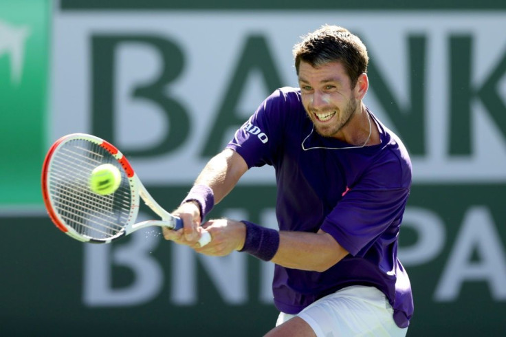 Great Britain's Cameron Norrie returns a shot against Grigor Dimitrov of Bulgaria during the semi-finals ATP Indian Wells Masters in the California desert