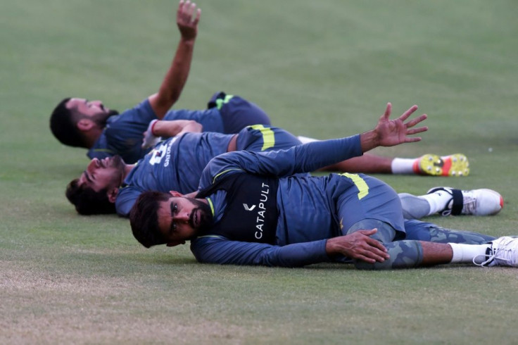 On the stretch: Pakistan captain Babar Azam exercises with teammates ahead of the 2021 T20 World Cup