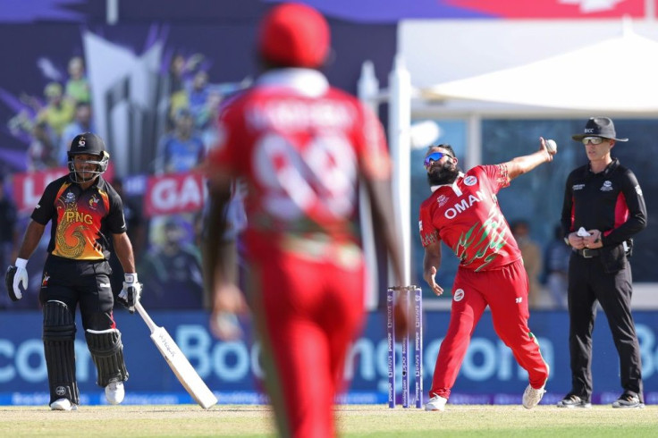 Leading from the front: Oman captain Zeeshan Maqsood bowling in Sunday's opener