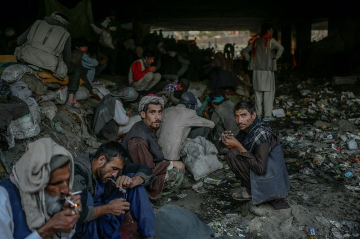 Drug addicts gather under a bridge in western Kabul synonymous with hard drugs and violent crime