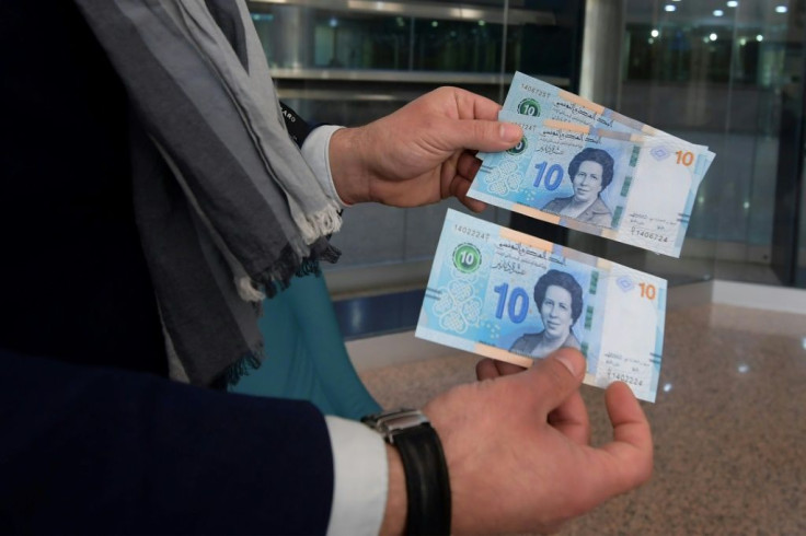 Tunisian bank notes, pictured inside a bank in the capital Tunis, on March 27 2020 -- the country has faced years of economic woes