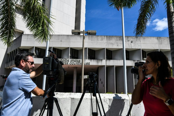 Media stand outside a courthouse in Miami, Florida on October 18, 2021 during a hearing for Colombian businessman Alex Saab, who was extradited to the US