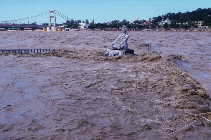 A statue of Hindu god Lord Shiva is pictured amid rising water levels of River Ganga after incessant rains in Rishikesh in India's Uttrakhand state