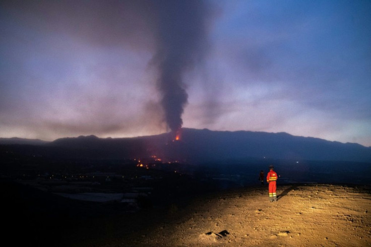 A Spanish Military Emergency Unit picture shows a UME member monitoring the lava flow as geologists warn they do not know how long the eruption will last