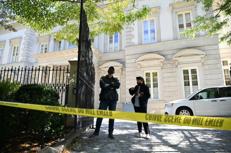 FBI agents outside the Washington home of Russian oligarch Oleg Deripaska