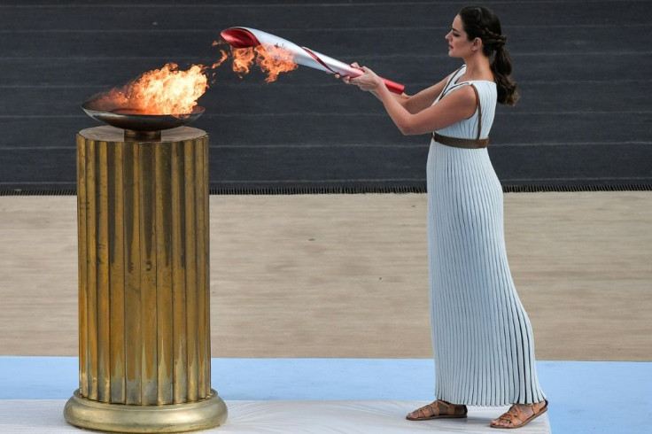 Greek actress Xanthi Georgiou lights the torch at a ceremony in Athens