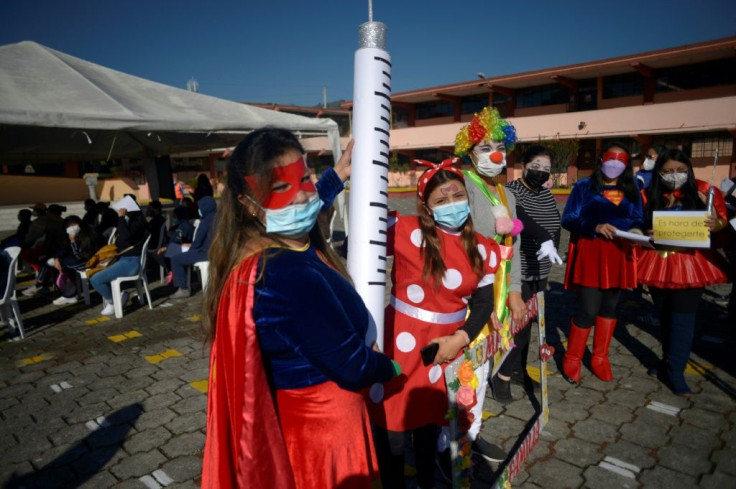 Teachers in Quito promote the start of vaccination of children aged 6 to over 11 against Covid-19 with a dose of the CoronaVac vaccine developed by China's Sinovac firm