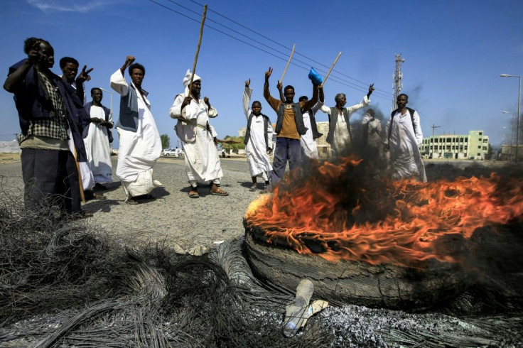 Members of the Beja ethnic group of east Sudan demonstrate outside the Osman Digna port in the Red Sea city of Suakin