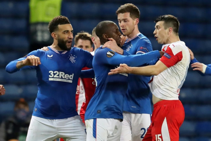 Ondrej Kudela (R) was given a 10-match ban for racially abusing Rangers midfielder Glen Kamara (C) earlier this year