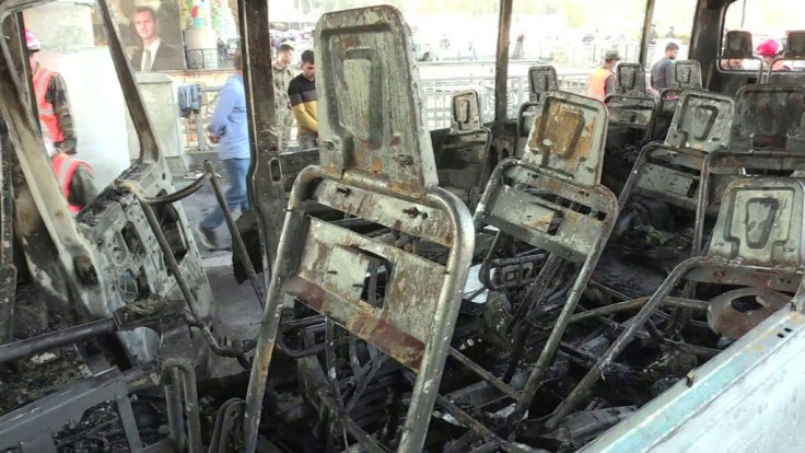 Mangled metal is all that is left of the seating after a bomb blast rips through an army bus in Damascus