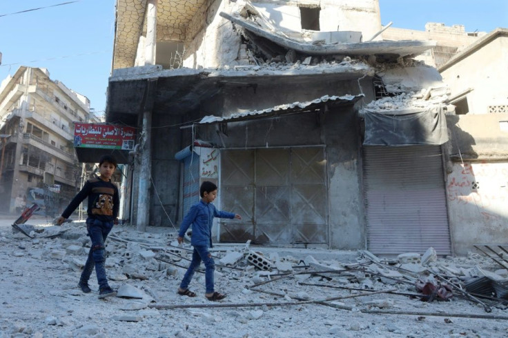 Debris fills the streets of the rebel-held Syrian town of Ariha after shelling by government forces kills eight people, three of them children, just as pupils are headed to school