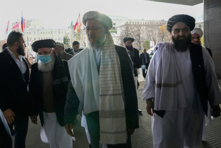 Deputy prime minister Abdul Salam Hanafi (C) and other Taliban officials arrive for high-profile talks in Moscow