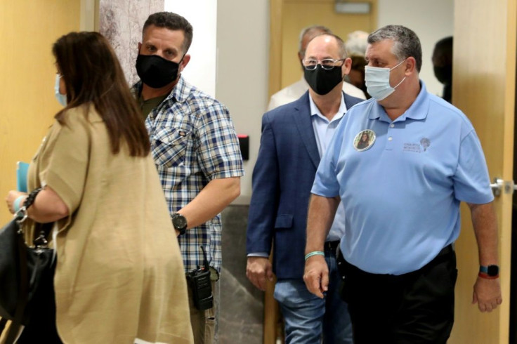 Relatives of victims of the February 2018 shooting at a high school in Parkland, Florida, arrive for the plea hearing of school shooter Nikolas Cruz