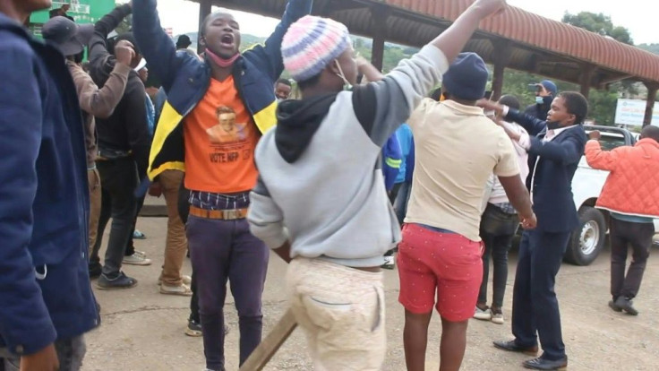 Protesters sing against police violence as unrest hits Eswatini