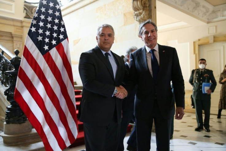 US Secretary of State Antony Blinken (R) is welcomed by Colombian President Ivan Duque at the Casa de Narino in Bogota