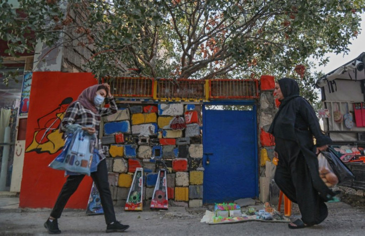 Iraqi Kurdish women walk in Halabja, part of the Kurdistan region which has cultivated an image of relative stability and tolerance