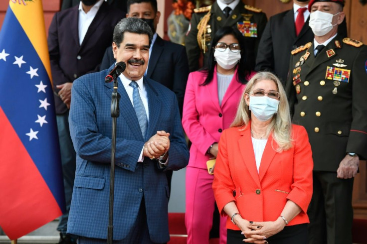 Venezuelan President Nicolas Maduro, seen here next to First Lady Cilia Flores (R) and Vice-President Delcy Rodriguez (C, behind) wants to normalize ties with neighboring Colombia