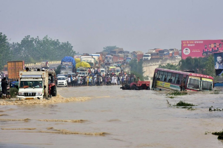 The death toll from days of flooding and landslides in India and Nepal is nearing 200, with whole families buried in their homes as forecasters warned of yet more heavy rain