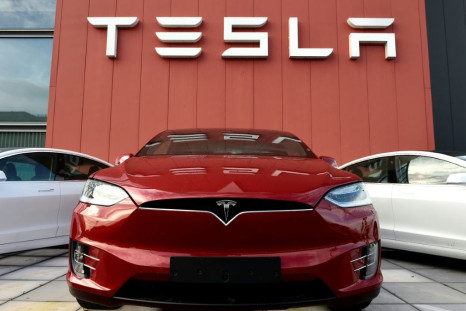 US investigators said a driver was at the wheel of a crashed Tesla, contradicting initial reports