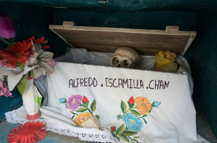 Residents of the Maya community of Pomuch in southeast Mexico clean the bones of their relatives in an annual ritual before the Day of the Dead festival