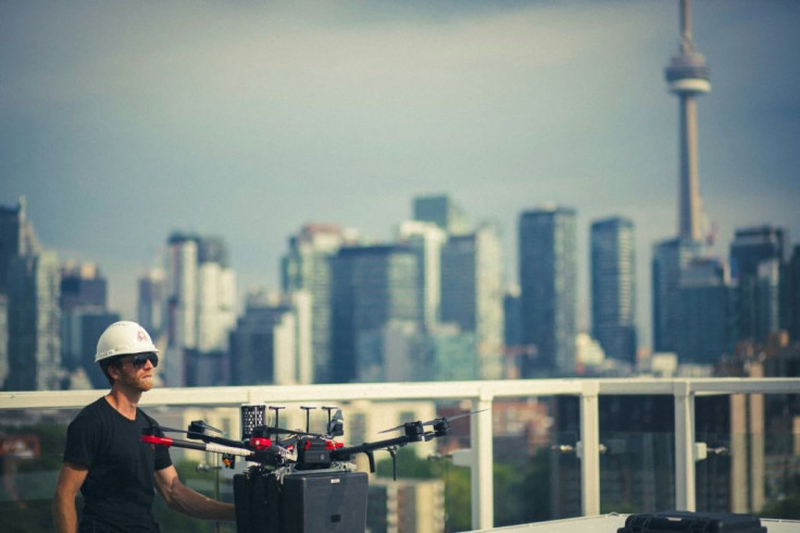 This handout photo released by Unither Bioelectronique and taken in September 2021 shows Unither Bioelectronique's drone transporting a pair of donor lungs, high above Toronto traffic at night