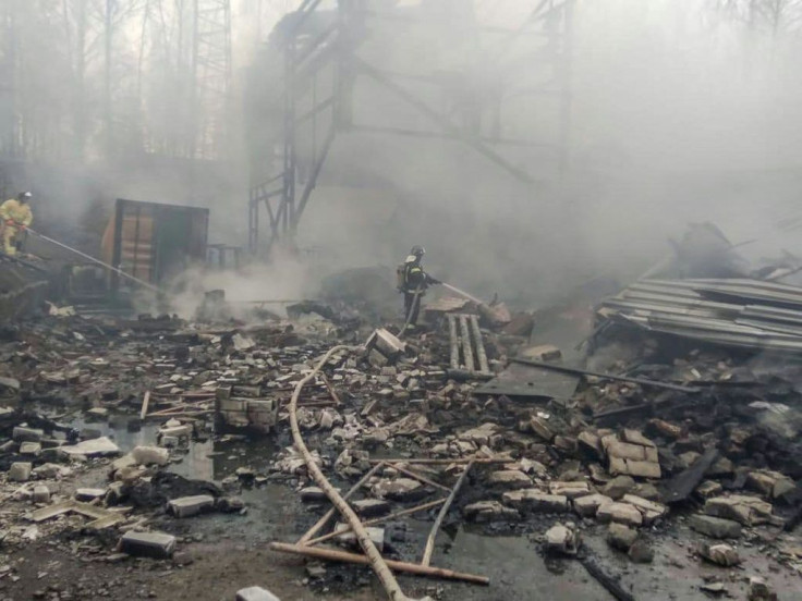 Firefighters working their way through the debris at the damaged factory building in the region of Ryazan
