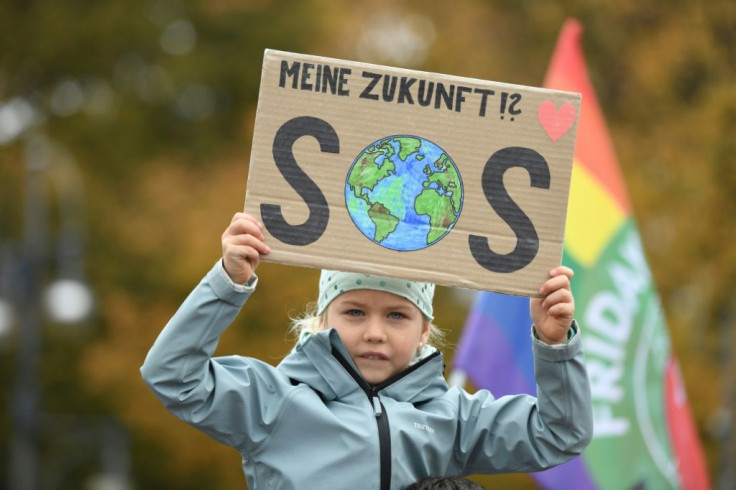 'My future? SOS' reads a placard held up by a very young activist at the climate rally in Berlin