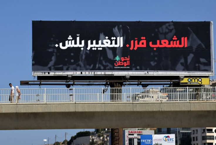 An electoral billboard reading "The people have decided, the change has started" in Dbayeh, east of Lebanon's capital Beirut, ahead of elections next year
