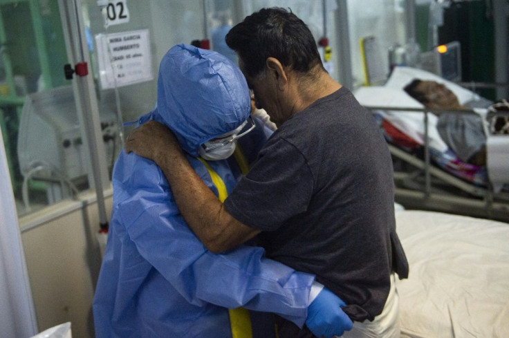 In this file photo taken on October 19, 2021, a health professional assists a COVID-19 patient at a hospital in northern Peru