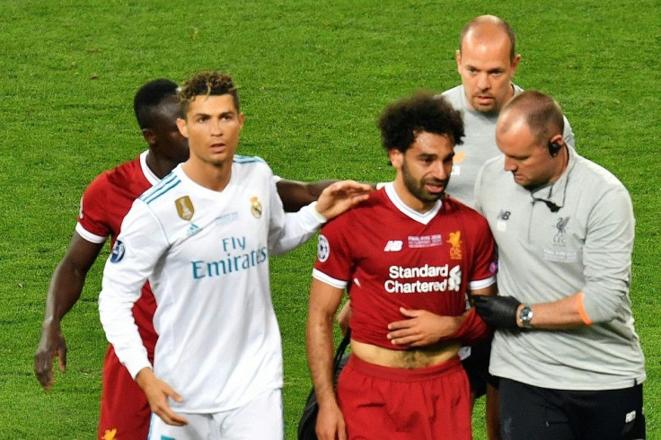 Cristiano Ronaldo consoles Mohamed Salah as the Egyptian goes off injured in the 2018 Champions League final. Real beat Liverpool 3-1.