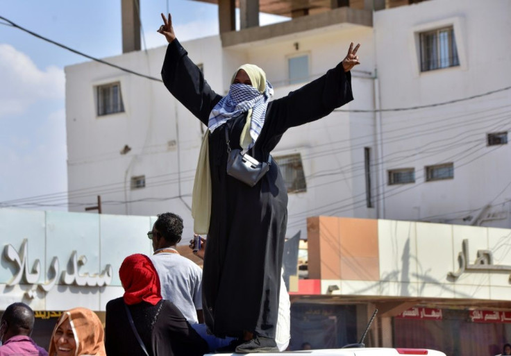 A Sudanese woman takes part in a protest in Khartoum Bahri to demand the government's transition to civilian rule, one of tens of thousands who took to the streets in recent days