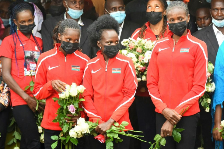 Kenyan athletes (L-R) Beatrice Chepkoech, Faith Kipyegon, Peris Jepchirchir and Eunice Sum attend the funeral of Agnes Tirop