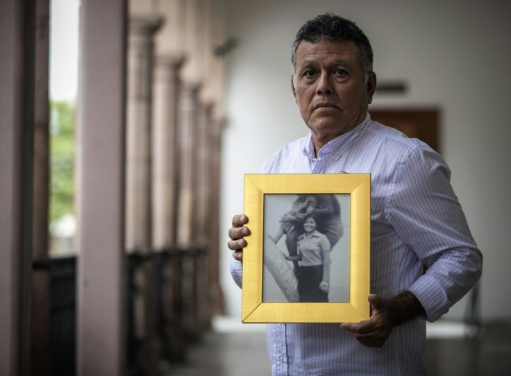 Roberto Martinez shows a picture of his sister Lourdes, who disappeared aged 23 in 1974 in Culiacan in northwest Mexico