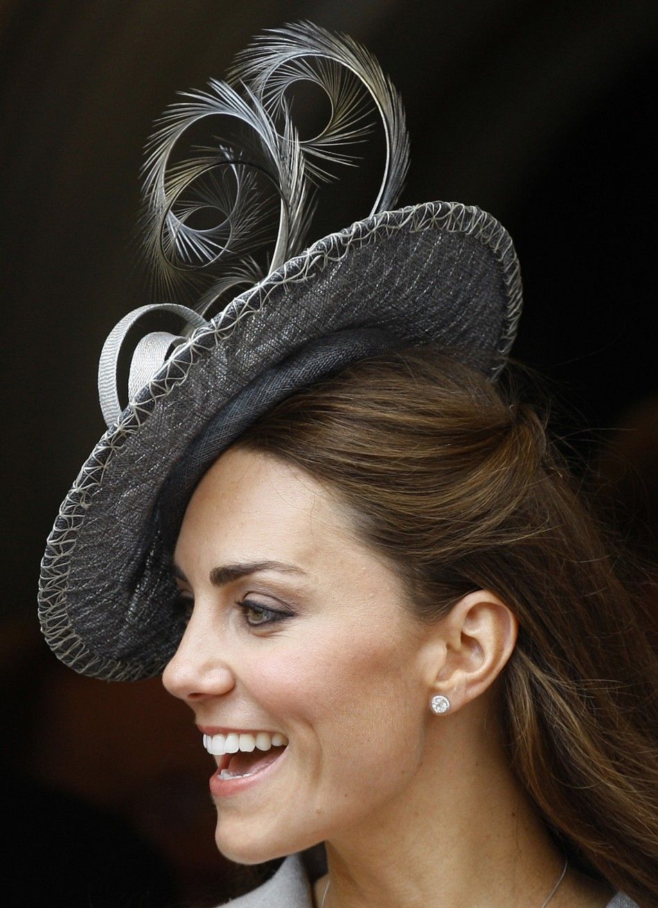 The Duchess of Cambridge smiles as she greets simpletons
