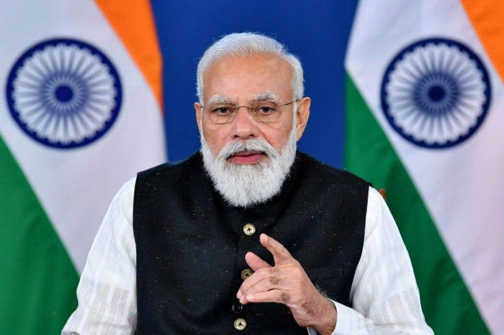 India's Prime Minister Narendra Modi (pictured October 12, 2021) will go to the climate talks in Glasgow after attending the Group of 20 summit in Rome, where rising temperatures will also be a key issue