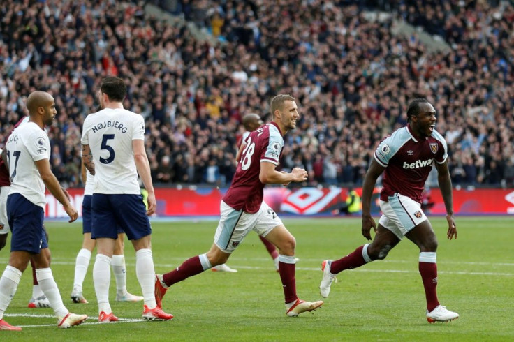Michail Antonio (R) celebrates his winning goal for West Ham against rivals Spurs