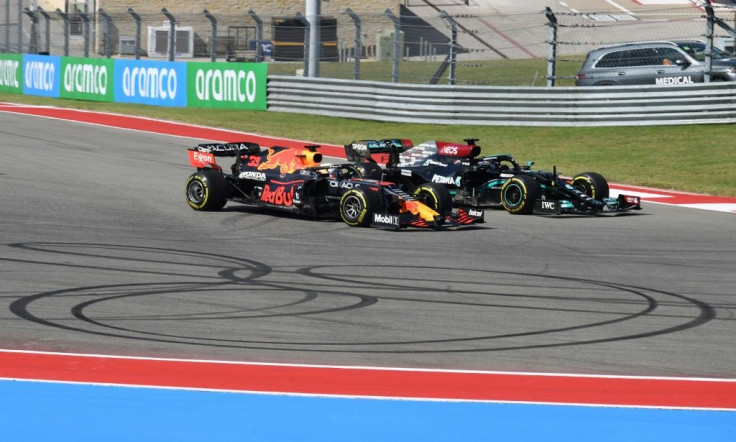 Side-by-side: Max Verstappen (left) and Lewis Hamilton fight for the lead
