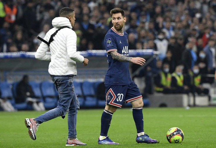 A young man invaded the pitch during Marseille's draw with PSG and approached Lionel Messi before being escorted off