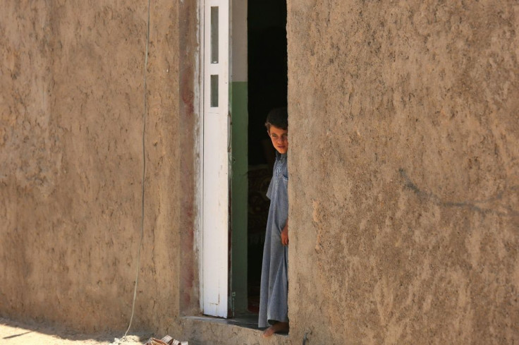 In Al-Sahl, small, almost windowless houses with iron doors line deserted alleys