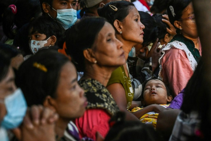 Devotees wait to pray to Buddhist monk Myaing Sayadaw at the Nyeyadham monastery