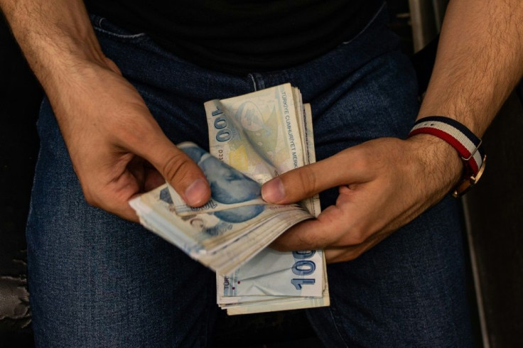 The lira touched new historic lows ahead of a cabinet meeting that could prove fateful to Turkey's economic and diplomatic standing for the coming months -- and possibly years, analysts say