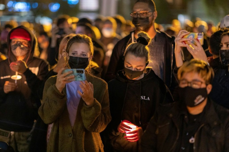 People attend a candlelight vigil in Burbank, California, for cinematographer Halyna Hutchins, who was accidentally killed by a prop gun fired by actor Alec Baldwin