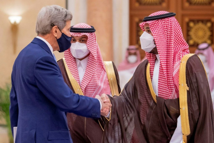 Saudi Crown Prince Mohammed bin Salman (R) welcomes US climate envoy John Kerry (L) during the Middle East Green Initiative Summit in the Saudi capital Riyadh